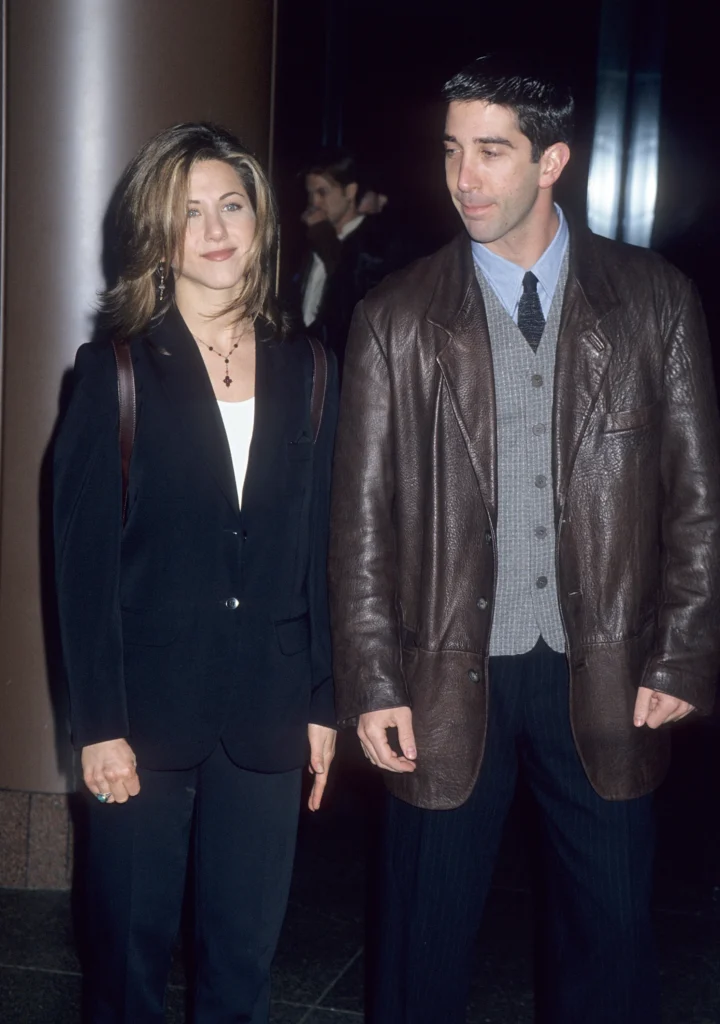 Jennifer Aniston and David Schwimmer attending an event together during the Friends era, showcasing the chemistry and friendship that sparked years of romance rumors among fans.