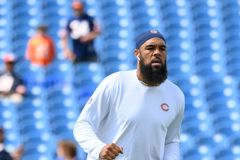Keenan Allen warming up before an NFL game while wearing a white Chicago Bears training shirt, highlighting the Keenan Allen shoulder injury discussion and NFL fitness concerns.
