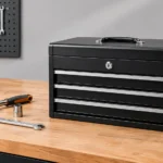 GearWrench 3 Drawer Tool Box 83151 black steel toolbox with silver drawer handles and hand tools on a workshop workbench.